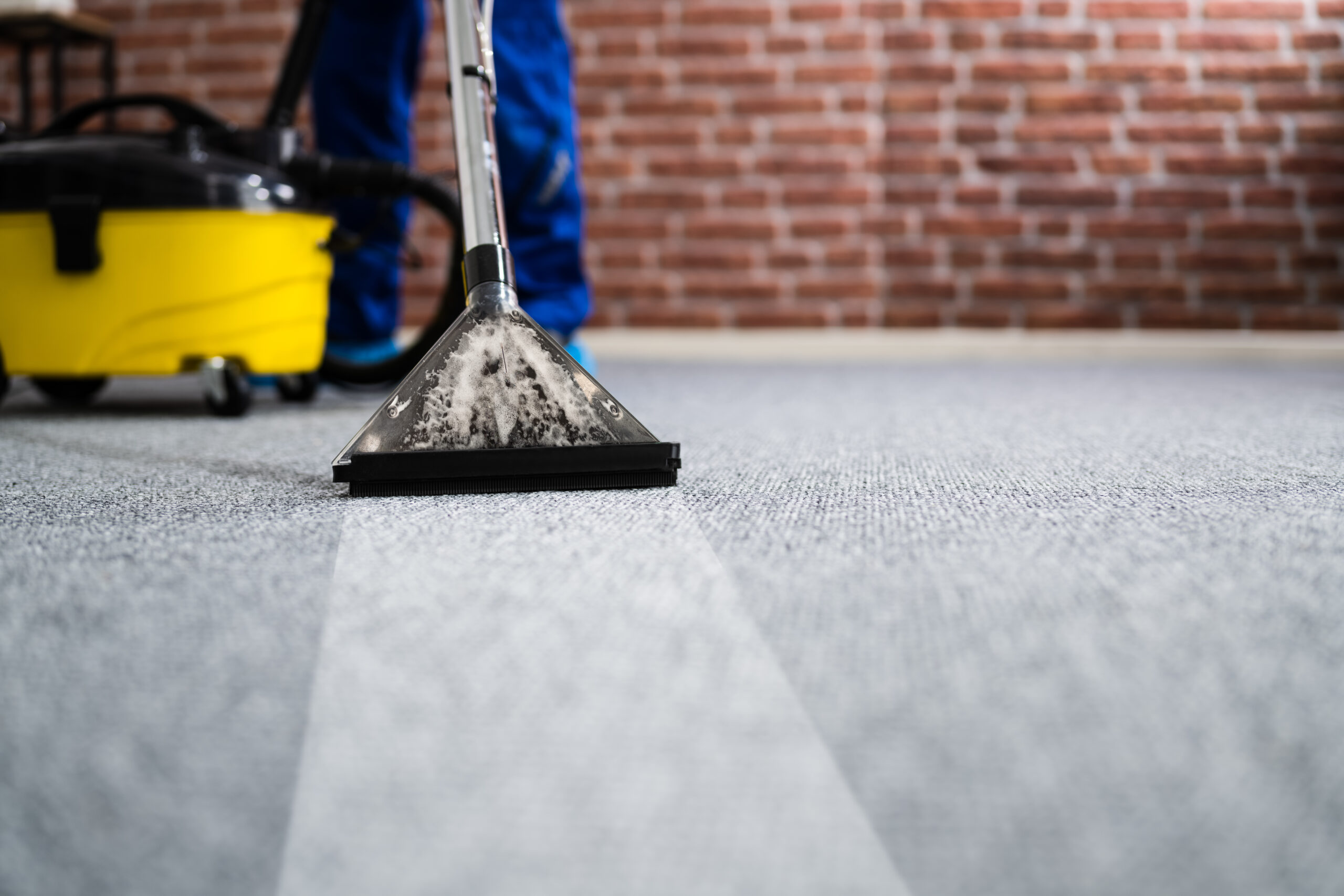 Janitor,Cleaning,Carpet,With,Vacuum,Cleaner,At,Home